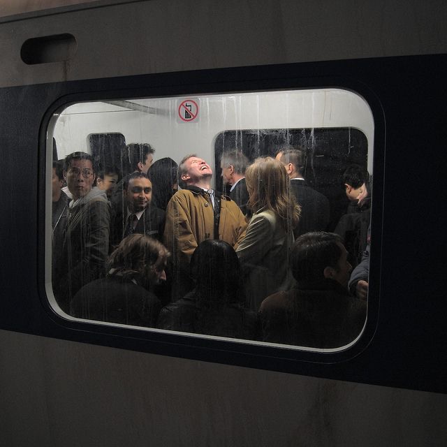 men laughing in a metro 
