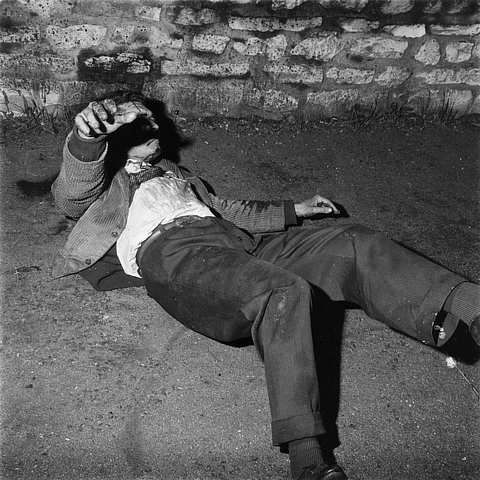 Algerian man laying on the ground